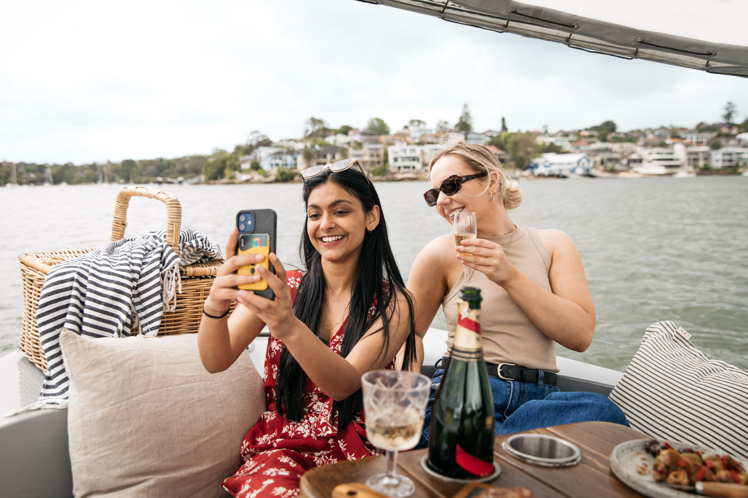 Two girls on a boat taking a selfie