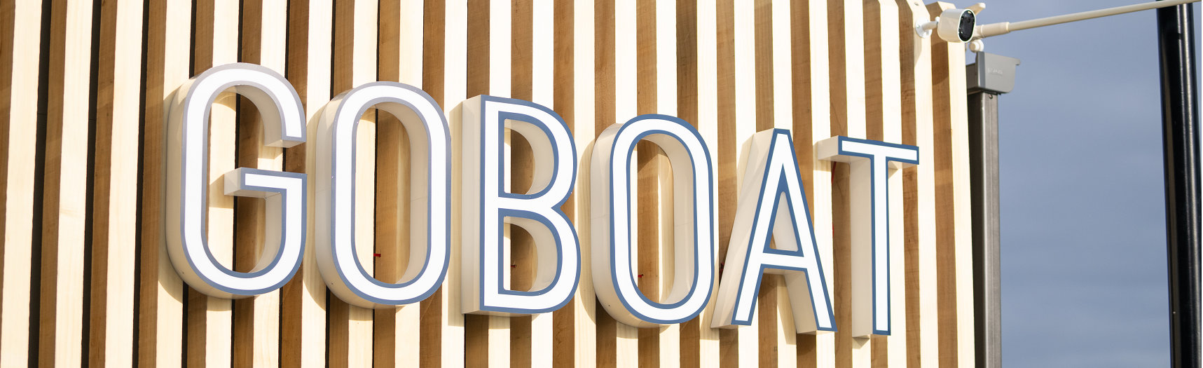 GoBoat sign on side of timber building